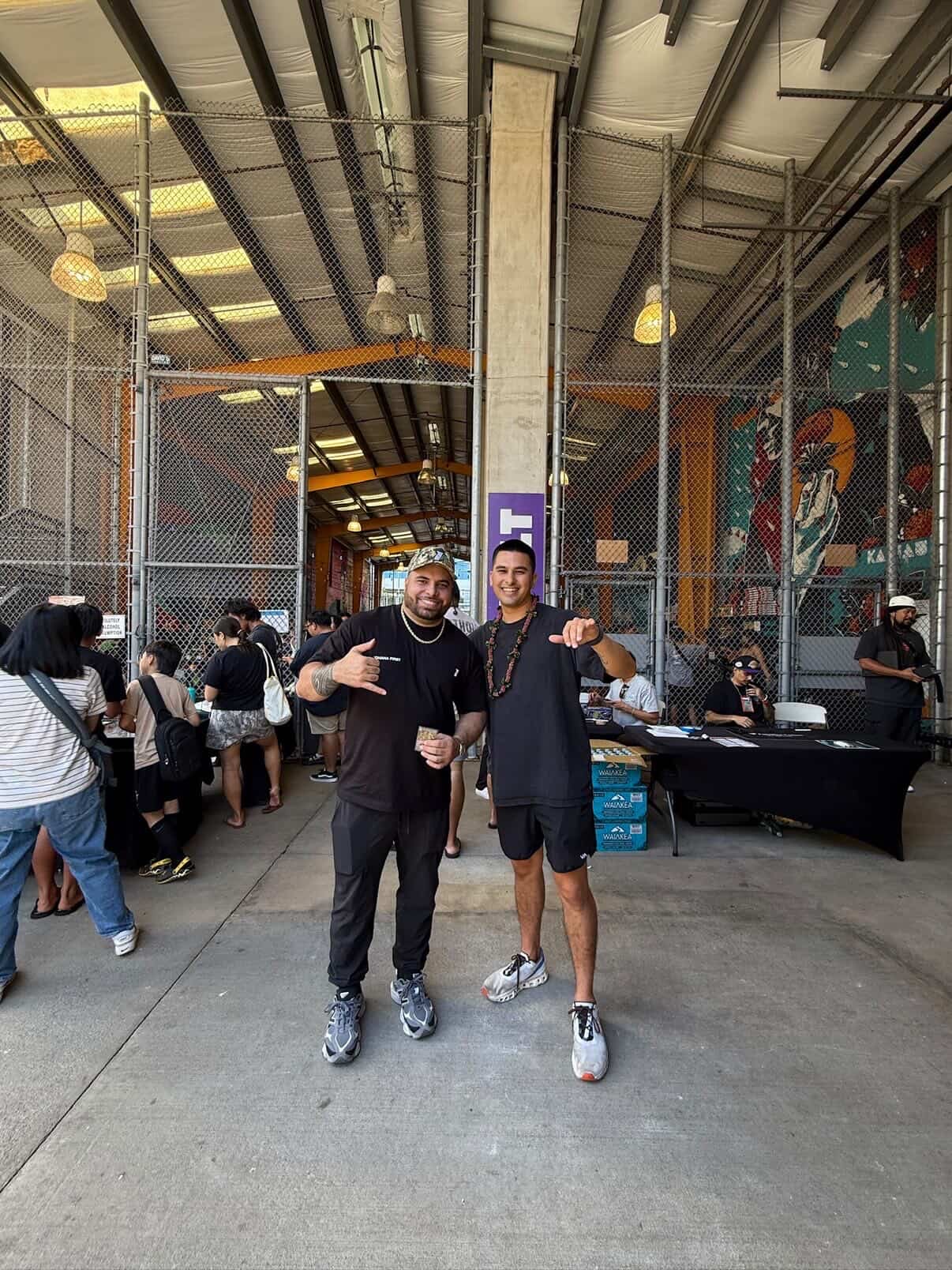 Group of attendees throwing shakas at the SALT entrance of the Keep It Aloha Card Show in Honolulu — a Hawaii card show scene where community comes first